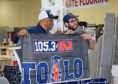 Drew Pearson Posing With A Fan Holding A Flag